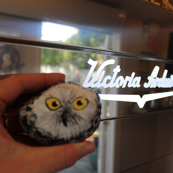Artisanal coffee experience at Snowy Owl featuring our signature painted owl stone art and professional Victoria Arduino espresso machine, highlighting our commitment to specialty coffee craftsmanship.