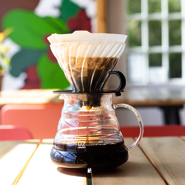 Fresh pour-over coffee being brewed with premium single-origin beans at Snowy Owl Coffee Roasters, highlighting our artisanal brewing methods and commitment to exceptional coffee.