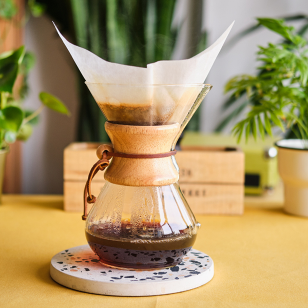 Detailed Chemex brewing guide featuring our specialty coffee beans, demonstrating the art of manual brewing for a clean, flavorful cup in our Cape Cod roastery's signature style.
