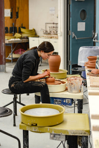 Meet Isabel Souza, the Cape Cod potter crafting custom mugs for Snowy Owl Coffee Roasters, blending artistic talent with precision craftsmanship to create locally-made vessels for specialty coffee.