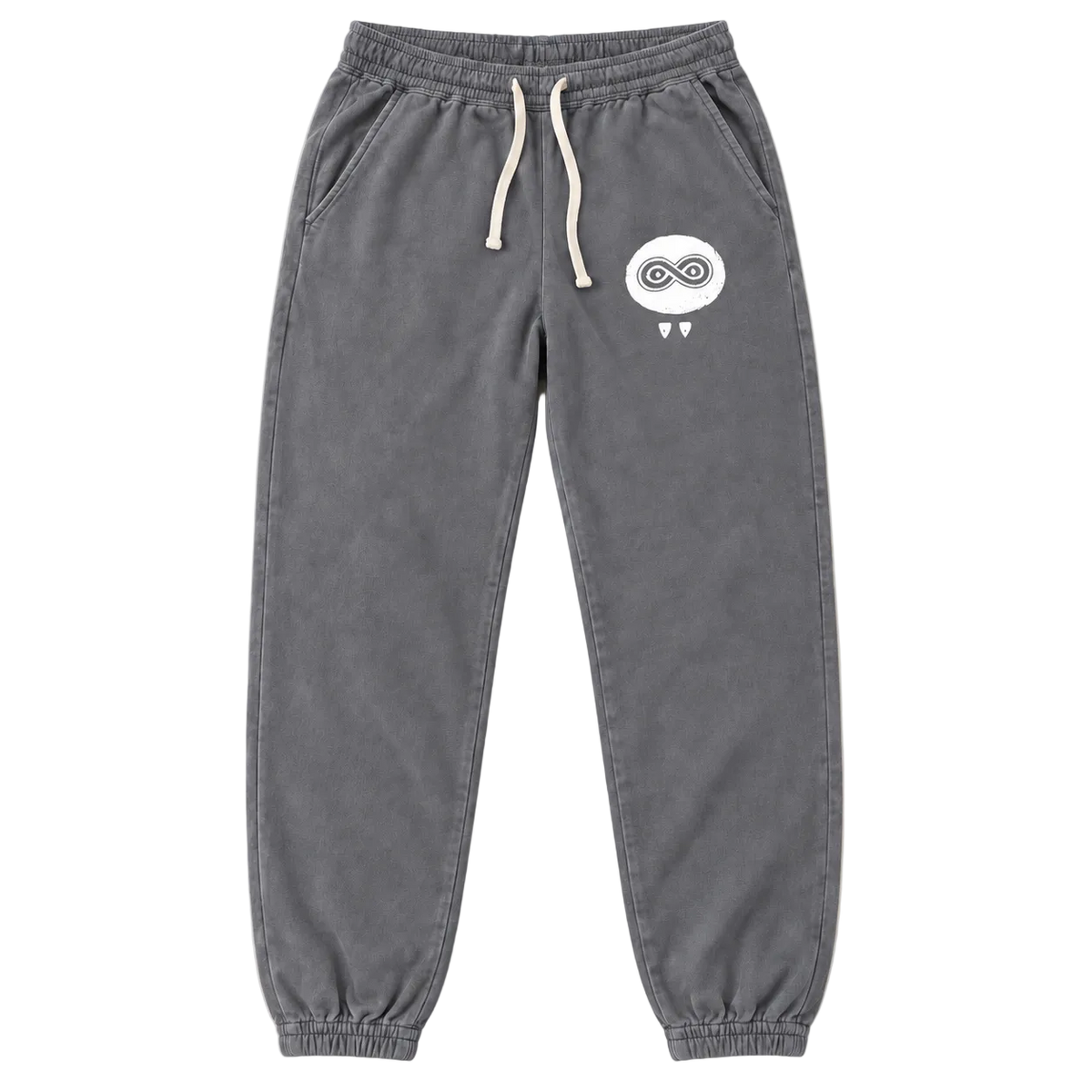 A pair of dark gray jogger sweatpants with an elastic waistband, white drawstrings, side pockets, and a small white cartoon graphic on the left thigh, shown against a plain off-white background.